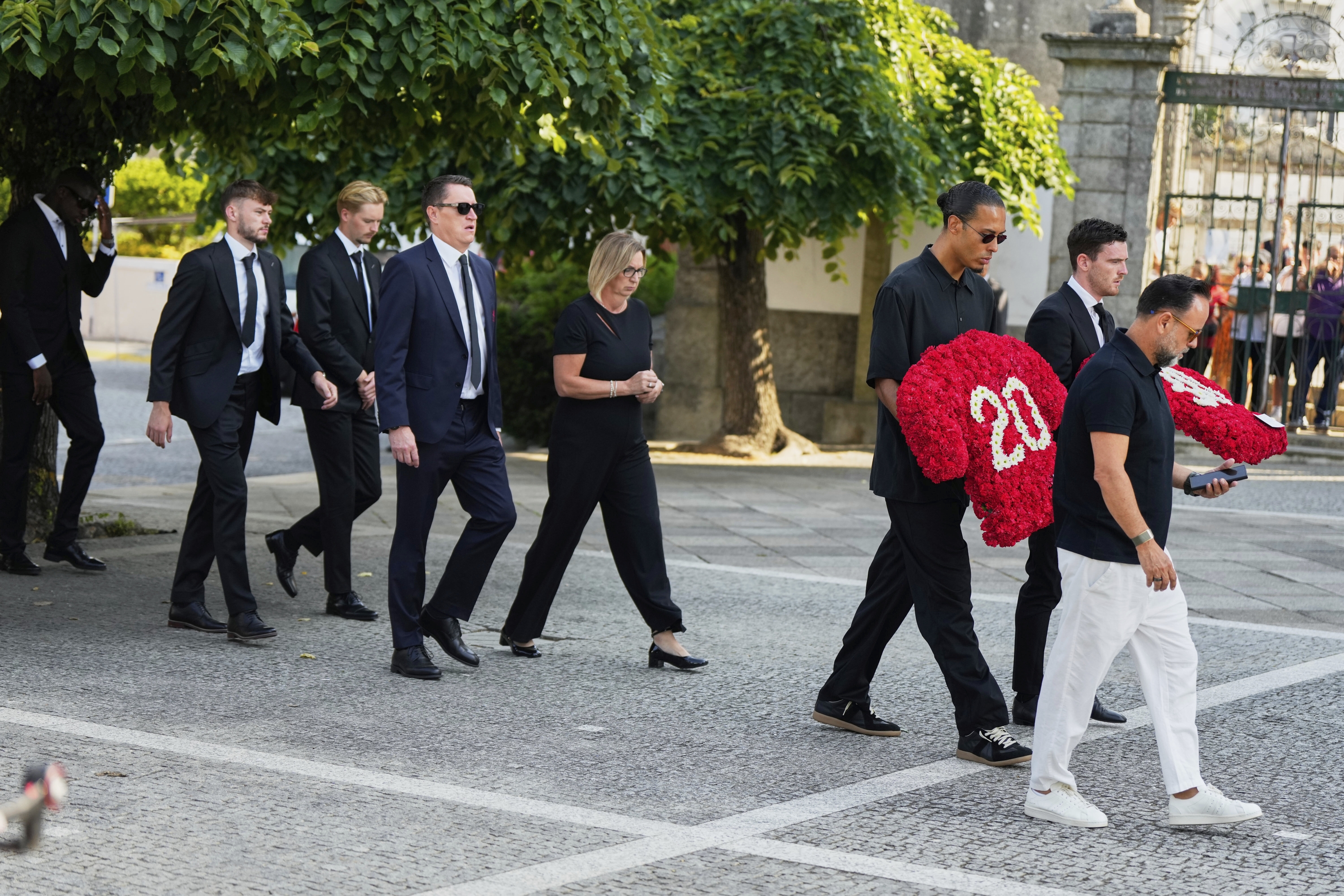 Liverpool Players Walk to the church to at least the funeral of Their Teammate Diogo Jota and His Brother André Silva, in Gondomar, Near Porto, Portugal, on Saturday, July 5, 2025. (AP Photo/Manu Fernandez)