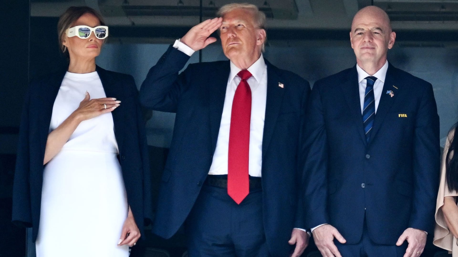 Donald Trump (M.) together with his wife Melanie and FIFA President Gianni Infantino.