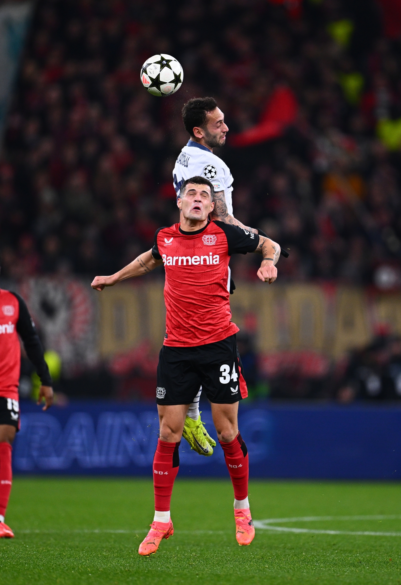 Leverkusen, Germany - December 10: Hakan Calhanoglu of Fc International competes for the Ball With Granit Xhaka of Bayer 04 Leverkusen During the UEFA Champions League 2024/25 League Phase MD6 Match Bethaeen Bayer 04 Leverkusen and FC International AT Bayarena On December 10, 2024 in 2024 in 2024 in Leverkusen, Germany. (Photo by Mattia Ozbot - Inter/Inter via Getty Images)