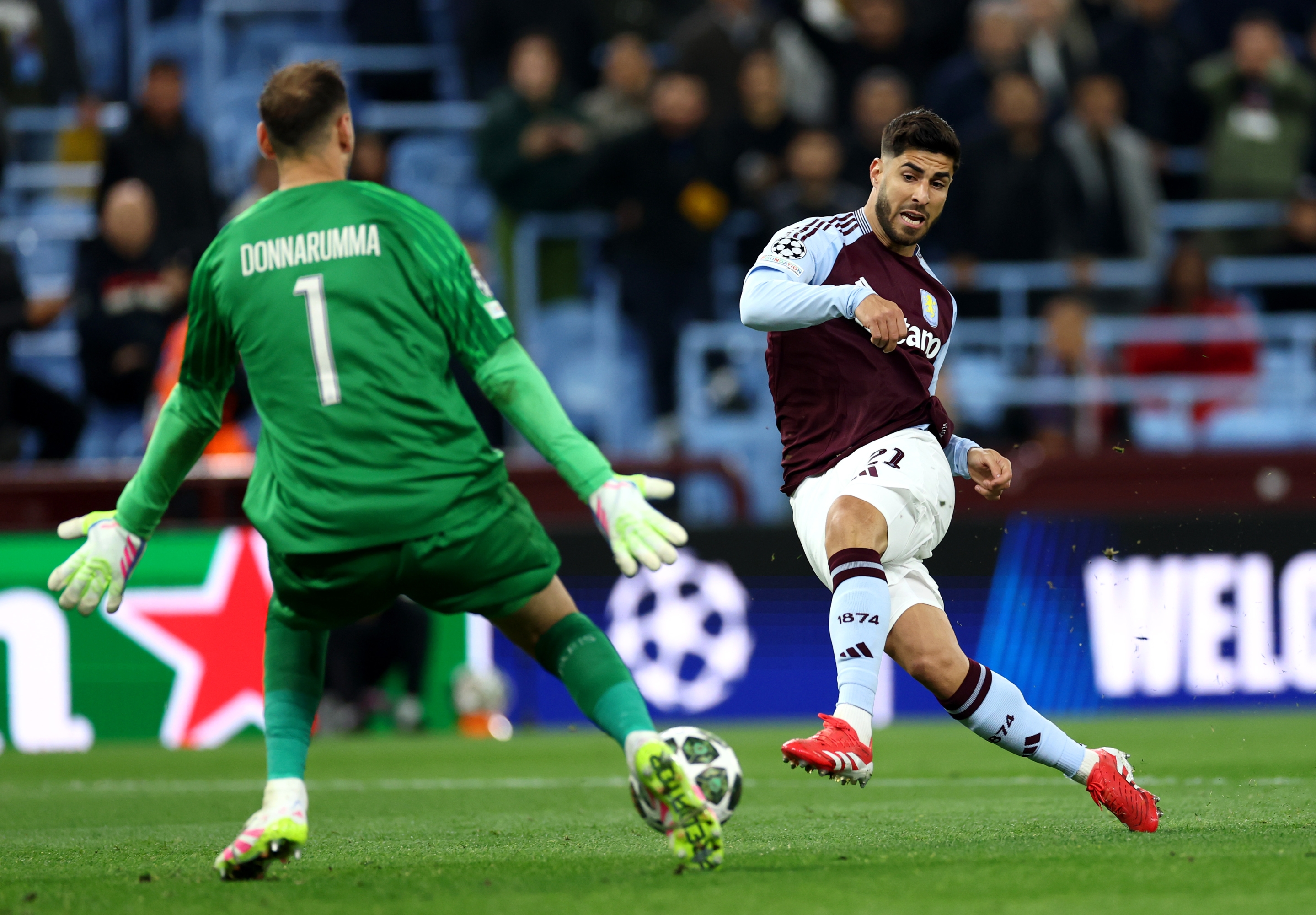 Birmingham, England-April 15: Marco Asensio of Aston Villa Takes a Shot Whilst Under Pressure from Gianluigi Donnarumma of Paris Saint-Germain During the UEFA Champions League 2024/25 Quarter Final Second Leg Match Betard Betard Aston Villa Fc and Paris Saint-Germain at Villa Park on April 15, 2025 2025 2025 In Birmingham, England. (Photo by Dan Istitent/Getty Images)