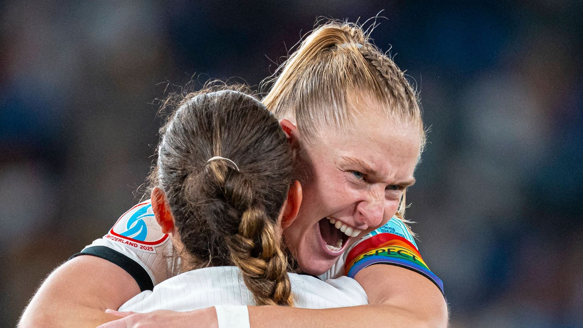 Overjoyed: Janina Minge hugs teammate Sara Däbritz after the game.