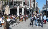 Full terraces on the Leidseplein in Amsterdam. In 2023 the city attracted 25.4 million day visitors.  