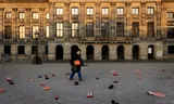 With red heels on Dam Square in Amsterdam, attention was drawn to femicide on initernational women's day. 