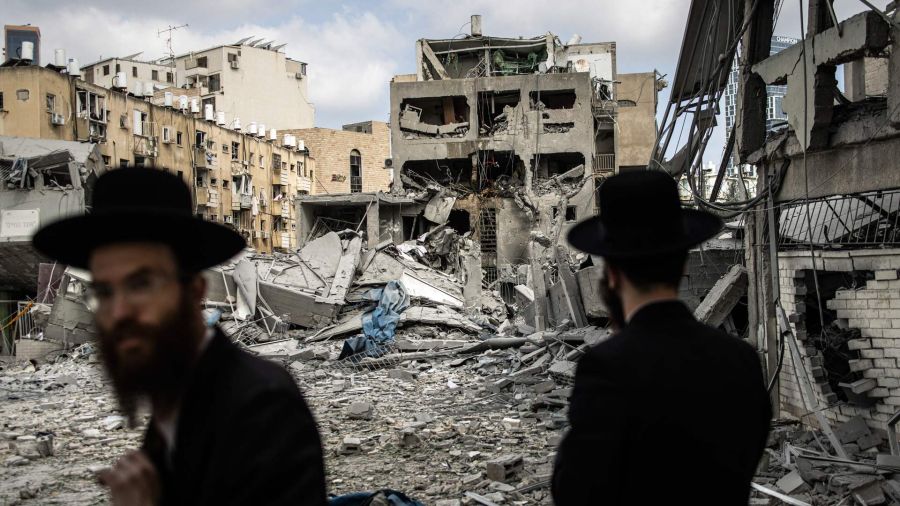 PHOTALERIA Ultra -Orthodox Jewish Men inspect the damage to the place of an Iranian missile attack in Bnei Brak, east of Tel Aviv