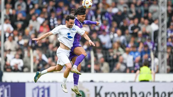 Osnabrück's Yigit Karademir (right) and wages Rilins Neziri