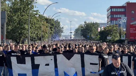 HSV fan march on the way to the stadium. 