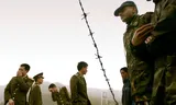 Indian and Chinese soldiers are on either side of the barbed wire on the border fence near Nathu la, in 2006. Trade between India and China resumed on July 6, 2006, when the 4267 meter high Nathu La-Pas in Sikkim opened for the first time in 44 years. 