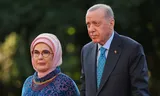   Emine Erdogan and her husband arrive at a dinner for state heads.