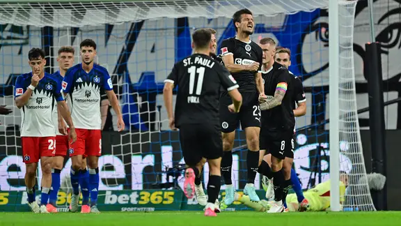 St. Pauli's players cheer a goal