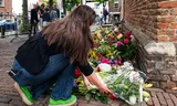At the Dorpskerk in Abcoude, people laid flowers from compassion after the violent death of 17-year-old Lisa. Photo Mona van den Berg  