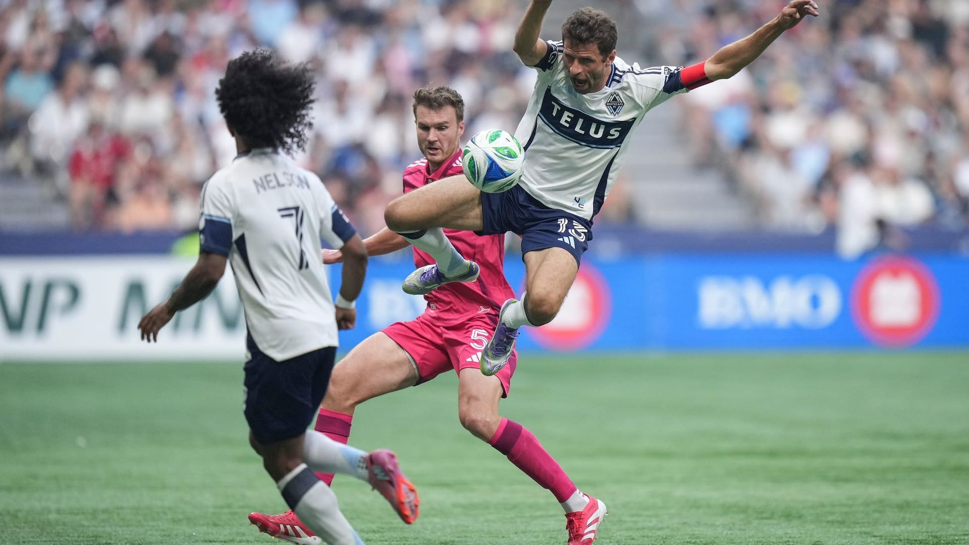Thomas Müller (right) and Henry Kessler fight for the ball in the game between Vancouver and St. Louis. Thomas Müller (right) and Henry Kessler fight for the ball in the game between Vancouver and St. Louis.