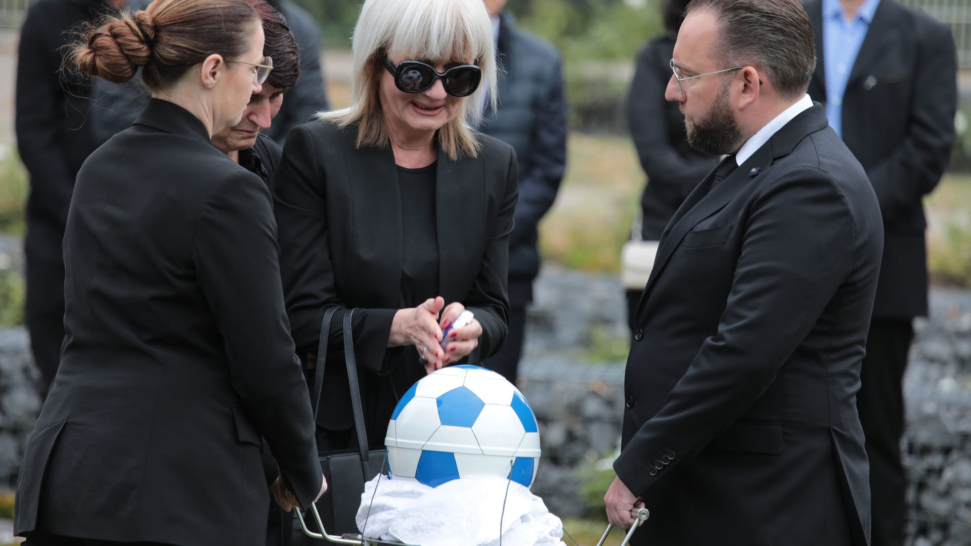 Uli Potofski was buried in a ball form urn.