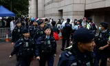 Outside the court building where 45 activists heard their punishment on Tuesday, a lot of police were going. A long line of interested people hoped in a place in the public gallery.