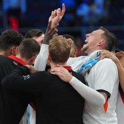 Daniel Theis cheers with the German team