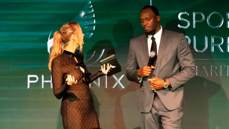 Woods im Gespräch mit Leichtathletik-Legende Bolt