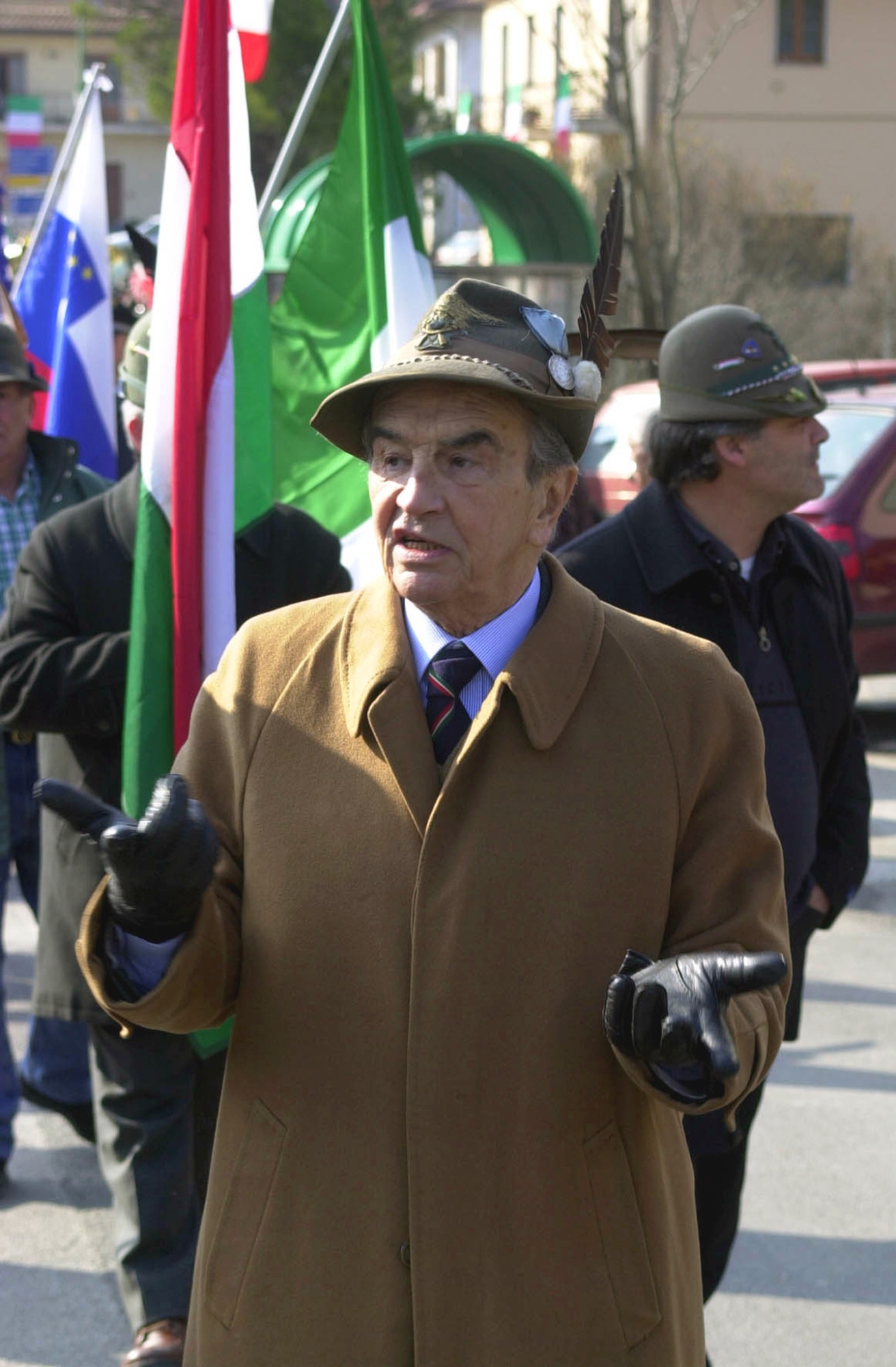 Inter's Vice President Peppino Prisco Gesticulates During A Parade with veterans of the Italian Army Alpini Corps in Isola del Gran Sasso, Near Teramo Central Italy, During the Alpini's Annual Meeting, Sunday Feb. 18, 2001. (AP Photo/Luciano Adriani)