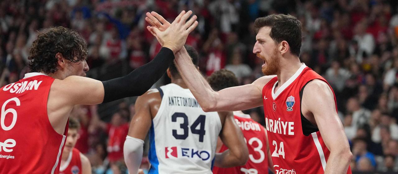 Ercan Osmani (right) cheers in the game against the Greeks