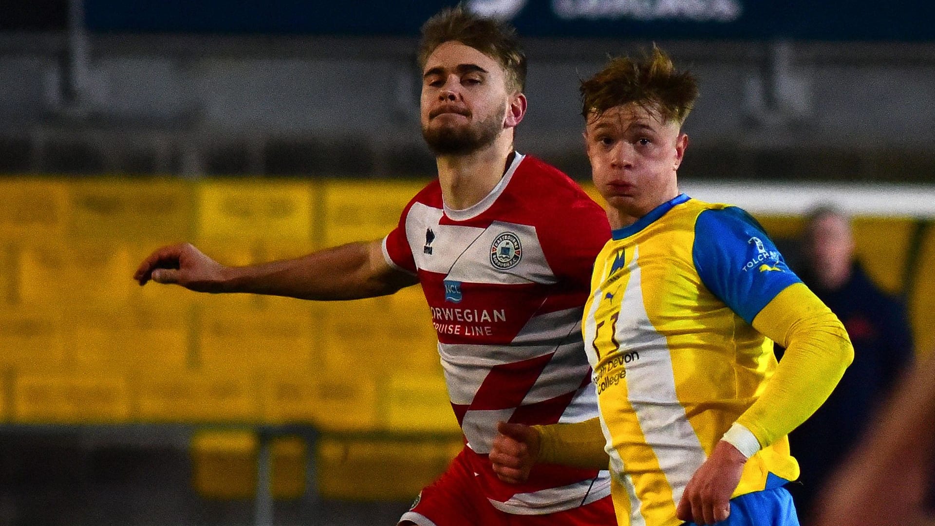 January 2024: Billy Vigar (left) borrowed from Arsenal to Eastbourne at the time in a duel with Torquay United.