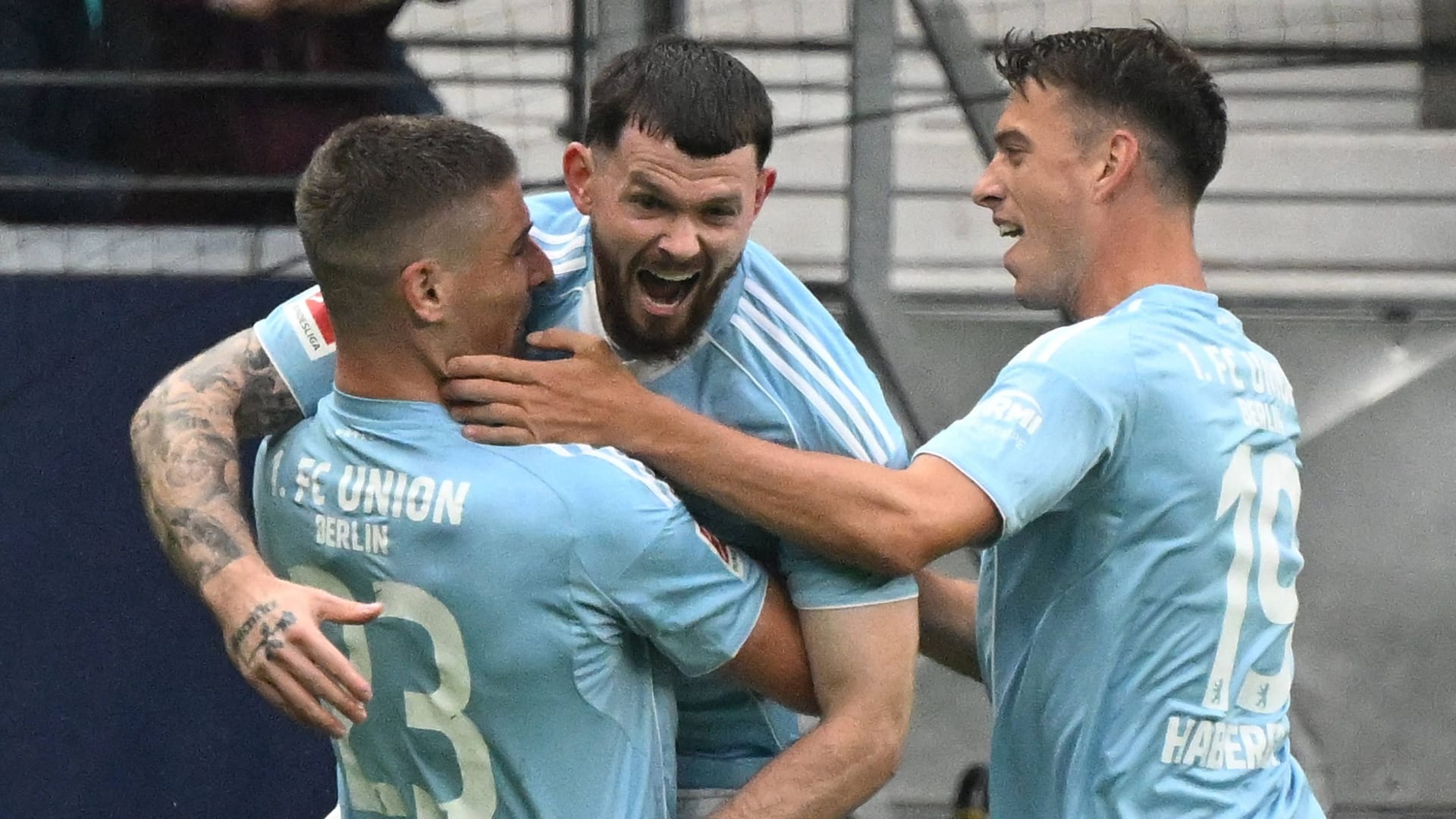 Oliver Burke (middle) cheered: he scored three times.