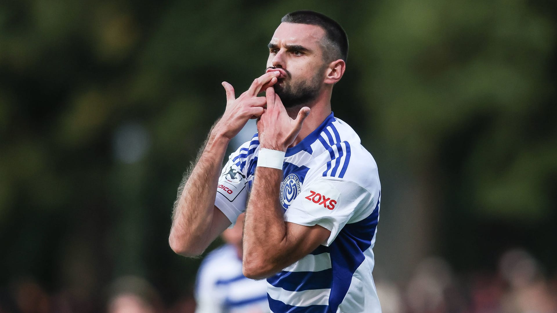 High feeling: Duisburg's Rasim Bulić cheers against Schweinfurt 05.