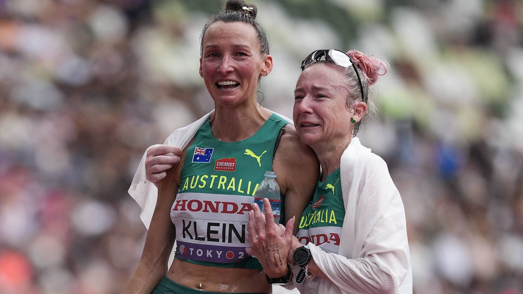 The tears near: Vanessa Wilson (right) with her Australian compatriot Sarah Klein after the marathon in Tokyo.