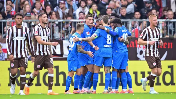 Leverkusen's players cheer a goal
