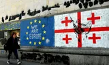   A mural of the flags of Georgia and the European Union (EU) in the center of Tbilisi.