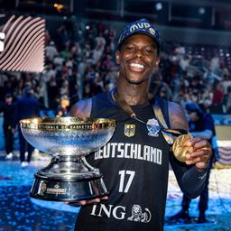 Dennis Schöder with his gold medal and trophy after the European Championship victory