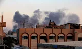 Smoke rises after an Israeli airstrike on Khan Younis on Sunday. 