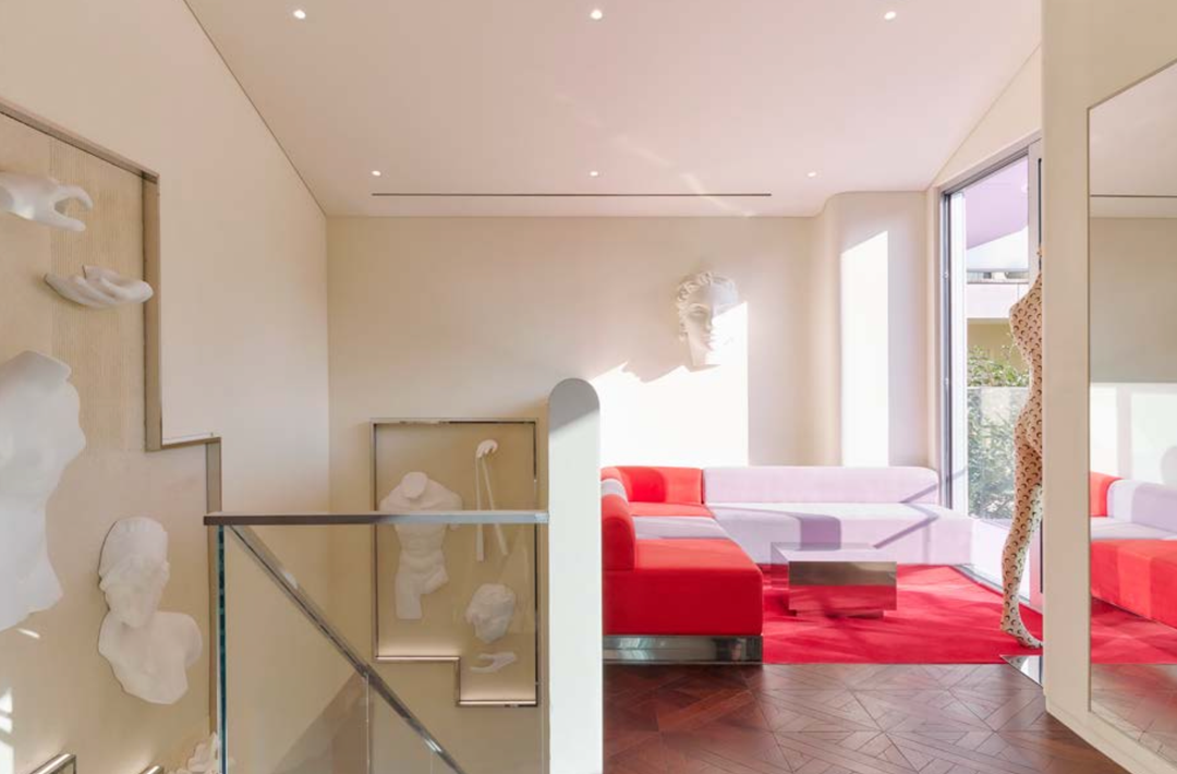 The first floor invites you to linger with a velvet sofa.