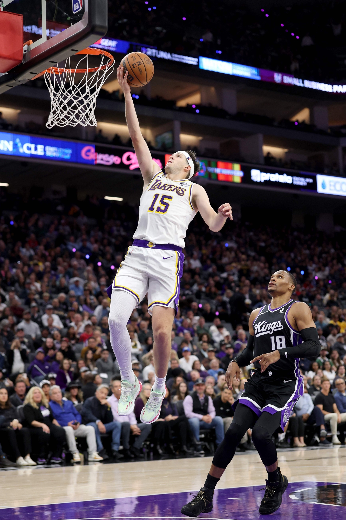 SACRAMENTO, CALIFORNIA - OCTOBER 26: Austin Reaves #15 of the Los Angeles Lakers goes up for a shot on Russell Westbrook #18 of the Sacramento Kings at Golden 1 Center on October 26, 2025 in Sacramento, California. Reaves finished with a career high 51 points. NOTE TO USER: User expressly acknowledges and agrees that, by downloading and/or using this photograph, user is consenting to the terms and conditions of the Getty Images License Agreement. Ezra Shaw/Getty Images/AFP (Photo by EZRA SHAW / GETTY IMAGES NORTH AMERICA / Getty Images via AFP)