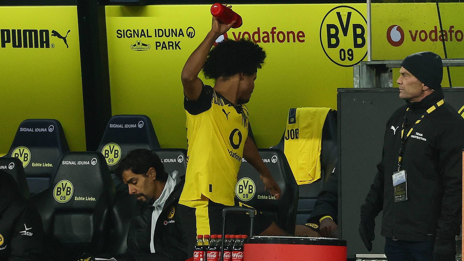 Angry: Dortmund's Adeyemi throws a drinking bottle at the BVB bench.