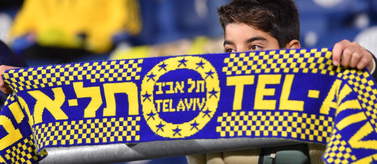 Maccabi Tel Aviv fan shows a scarf