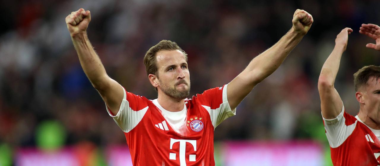 Harry Kane raises both arms