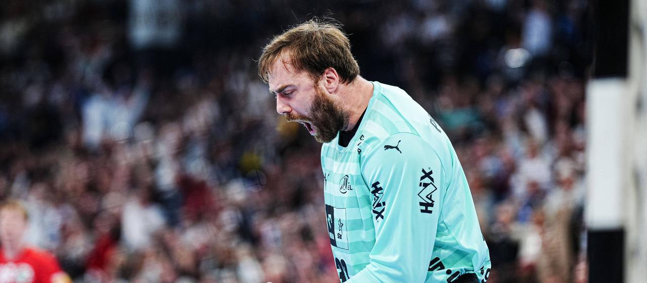 Kiel's Andreas Wolff cheers his parade