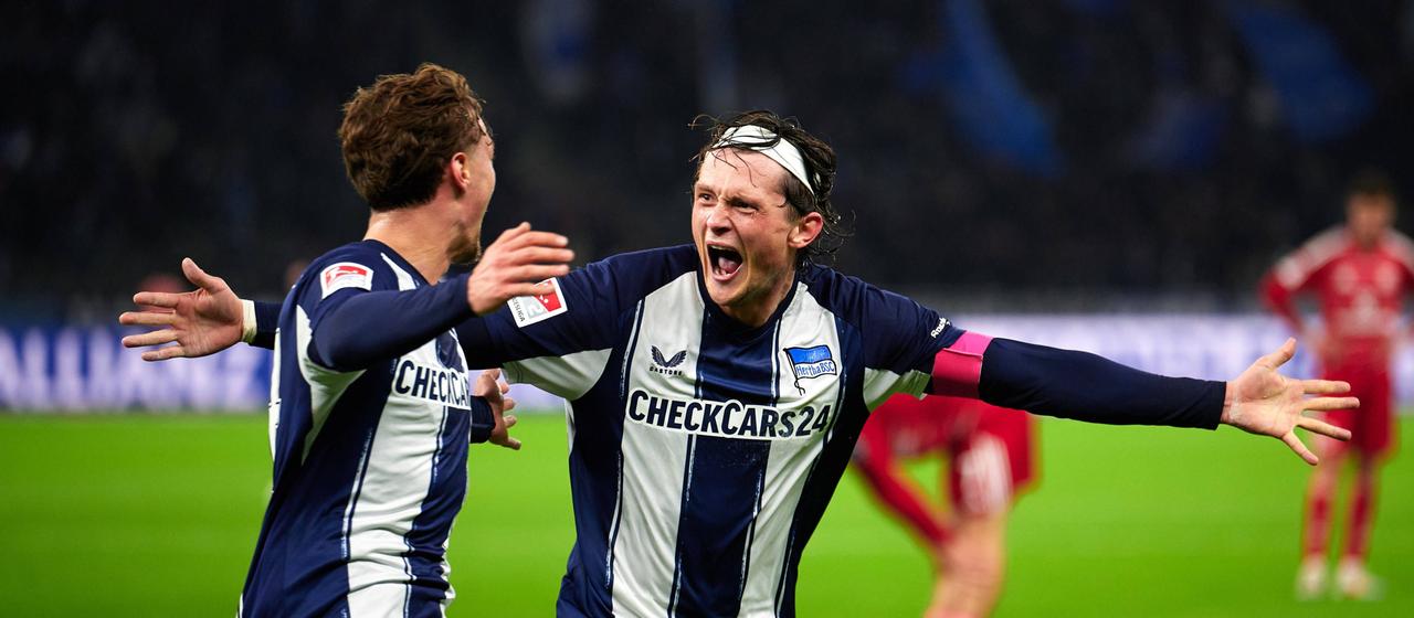 Hertha's Maurice Krattenmacher celebrates his goal with teammate Fabian Reese