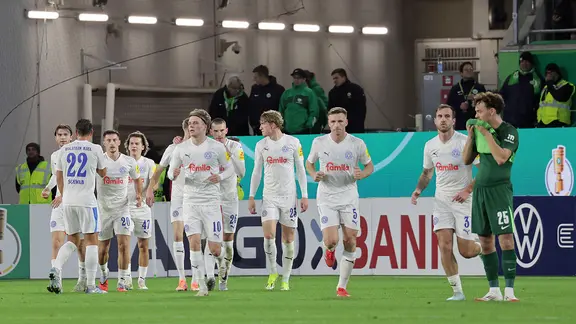 Kiel's players celebrate a goal