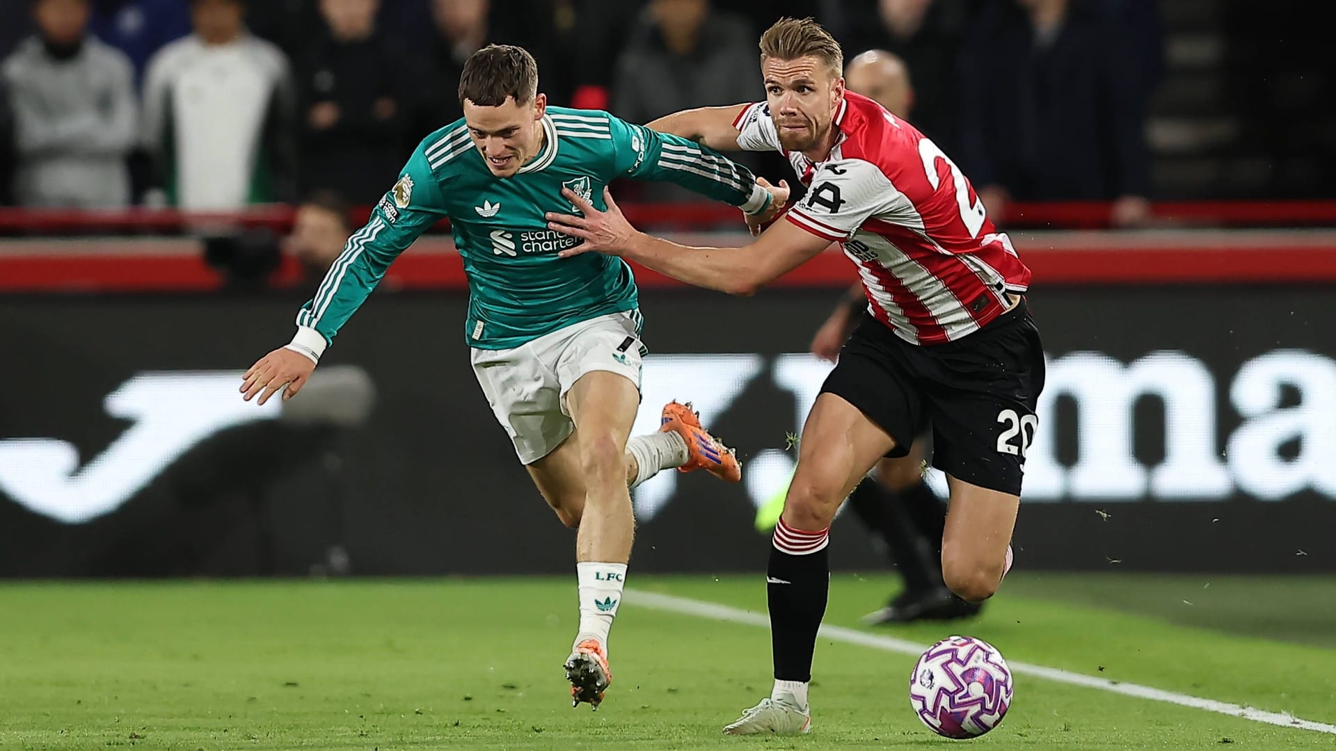 Forced away: Liverpool's Florian Wirtz (left) against Brentford's Kristoffer Ajer.