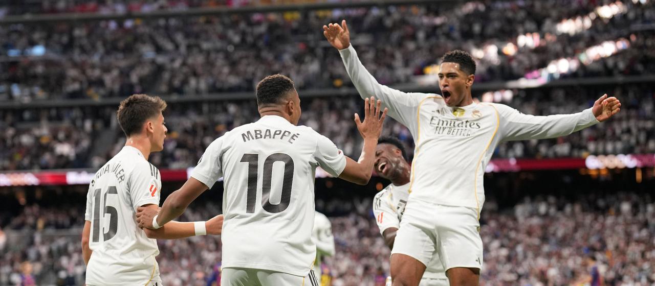 Real Madrid players celebrate after scoring a goal in the Classico