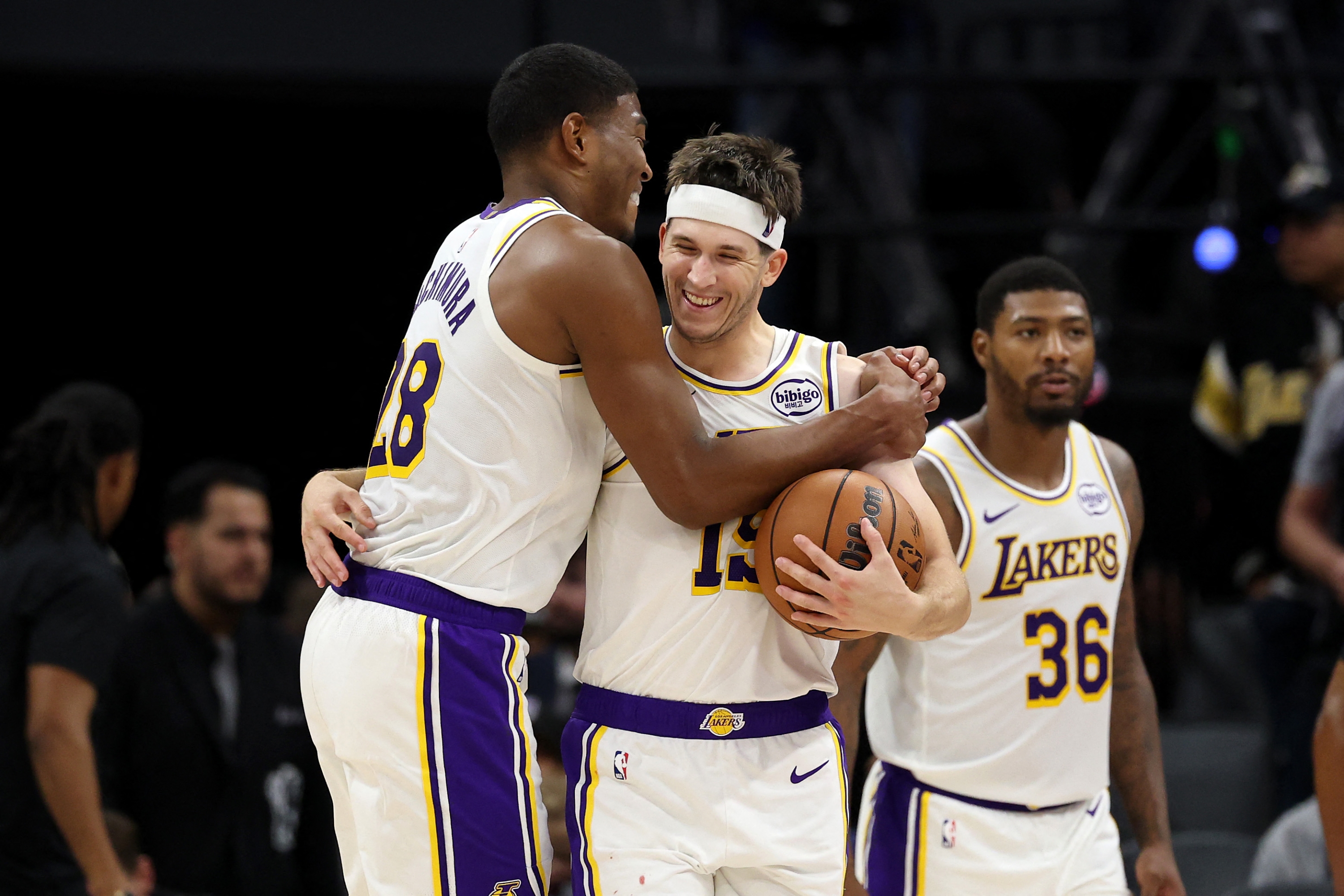 SACRAMENTO, CALIFORNIA - OCTOBER 26: Rui Hachimura #28 congratulates Austin Reaves #15 of the Los Angeles Lakers after they beat the Sacramento Kings at Golden 1 Center on October 26, 2025 in Sacramento, California. Reaves finished with a career high 51 points. NOTE TO USER: User expressly acknowledges and agrees that, by downloading and/or using this photograph, user is consenting to the terms and conditions of the Getty Images License Agreement. Ezra Shaw/Getty Images/AFP (Photo by EZRA SHAW / GETTY IMAGES NORTH AMERICA / Getty Images via AFP)
