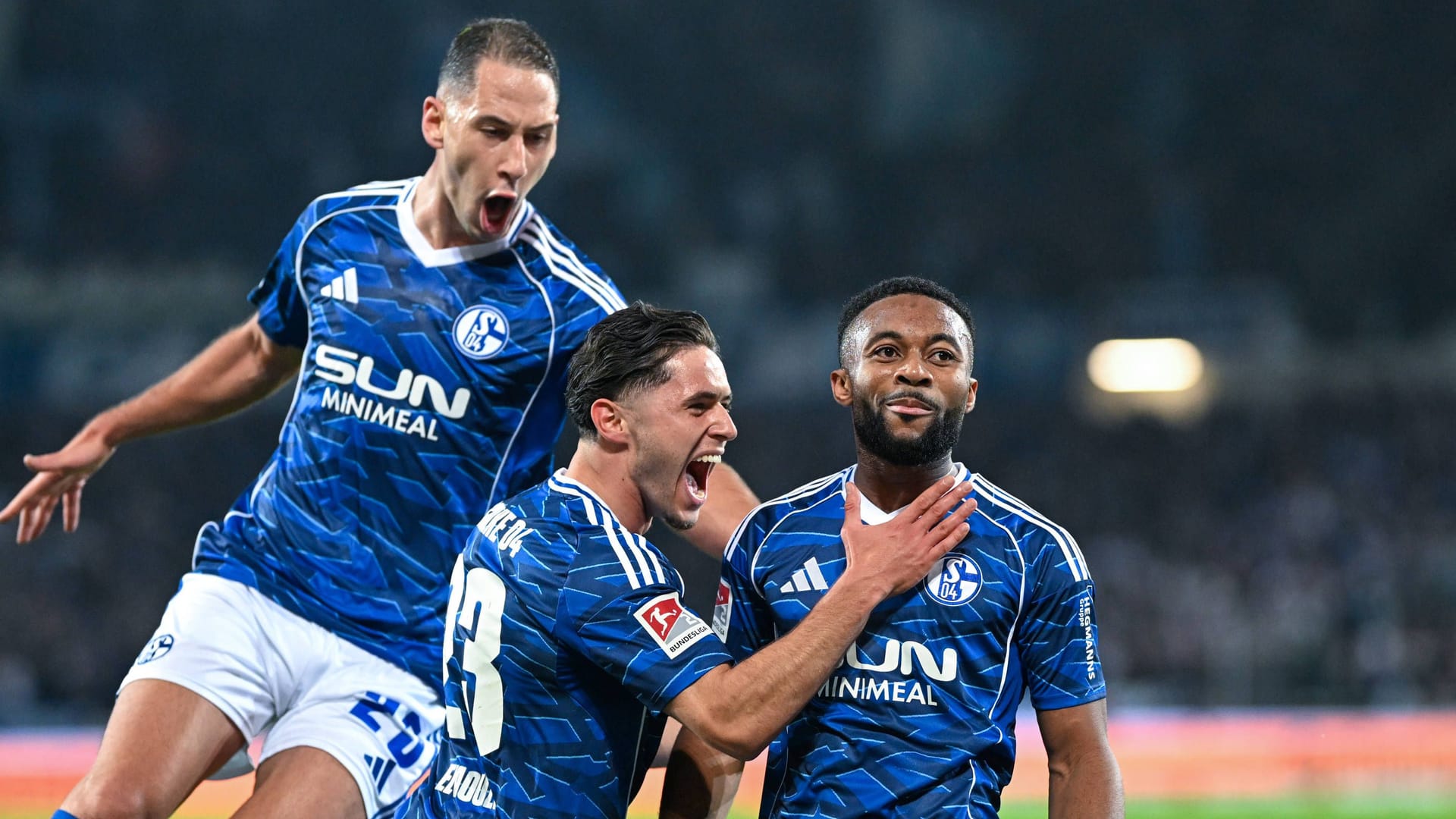 Match winner: Schalke's Sylla (r.) is celebrated for his goals against Hannover.