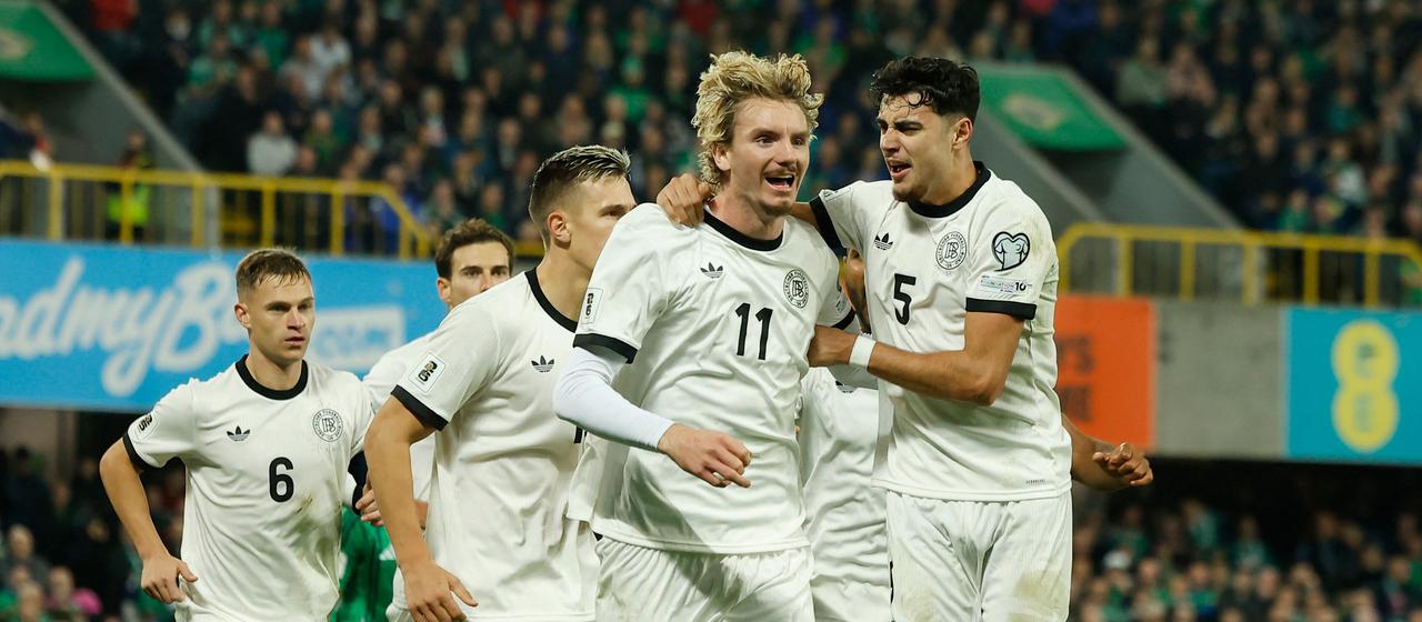 Nick Woltemade celebrates his goal with Pavlovic 