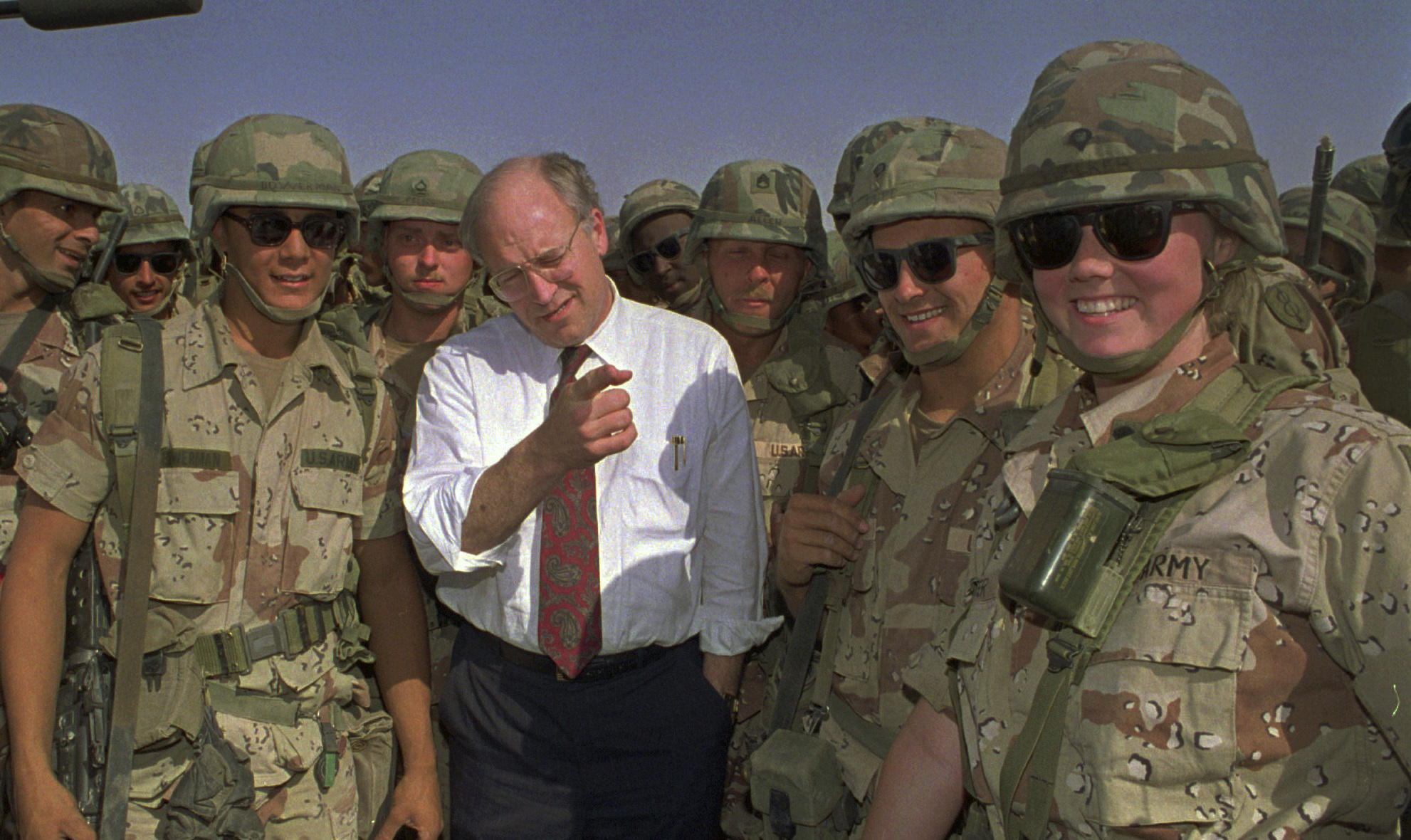 FILE - Defense Secretary Dick Cheney poses with some of the US Army troops stationed in southern Iraq in this May 7, 1991 file photo. (AP Photo/Bill Haber, File)