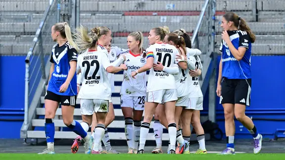 Hamburg's players react to a goal
