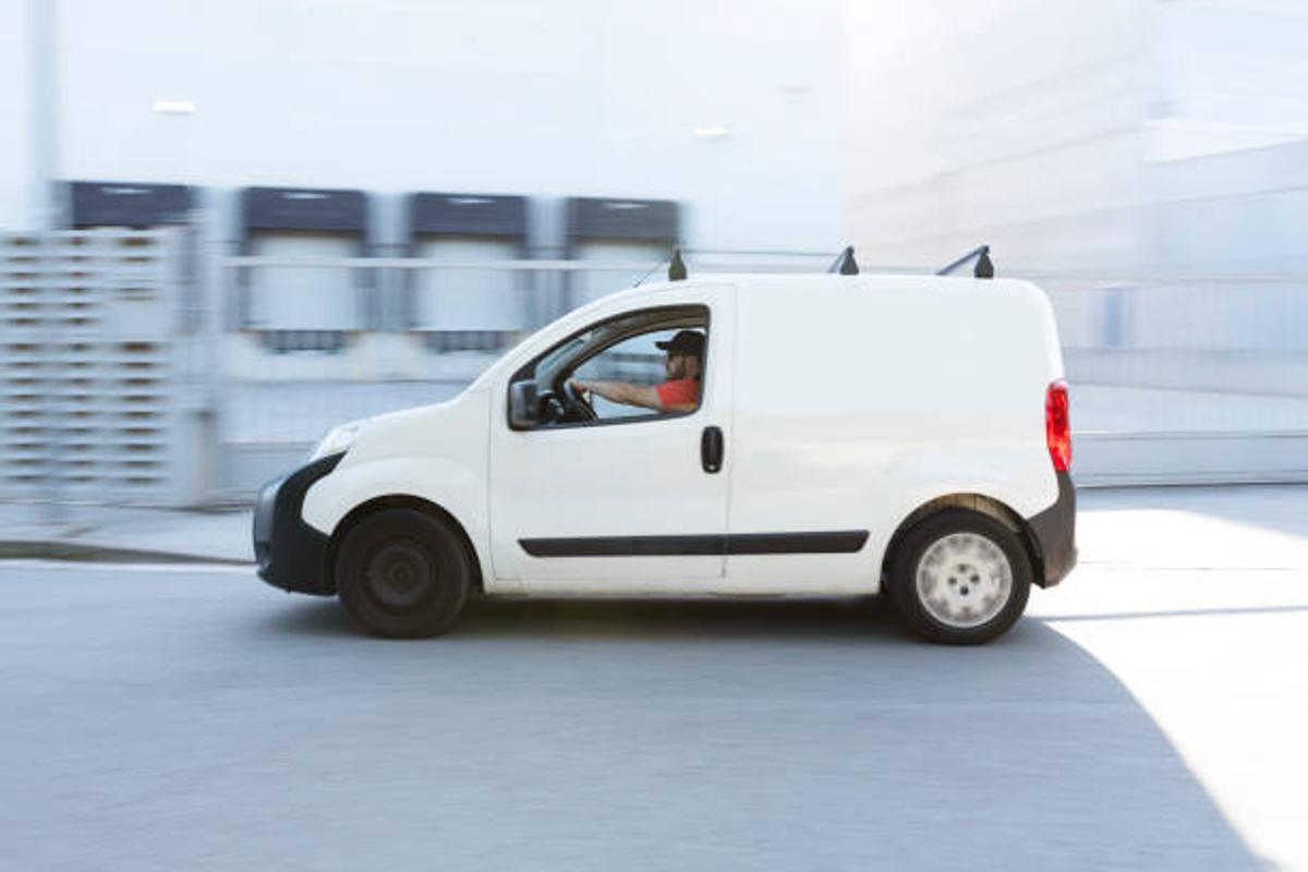 Fast delivery truck traveling through the city street