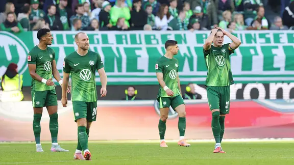Disappointed Wolfsburg players