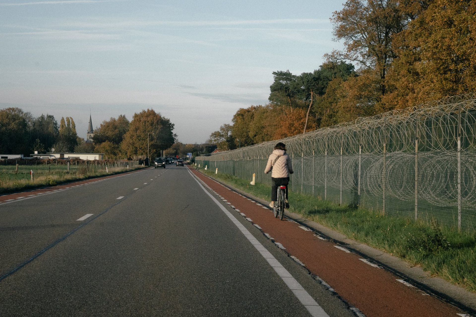 A cyclist rides past the Kleine-Brogel military base. 