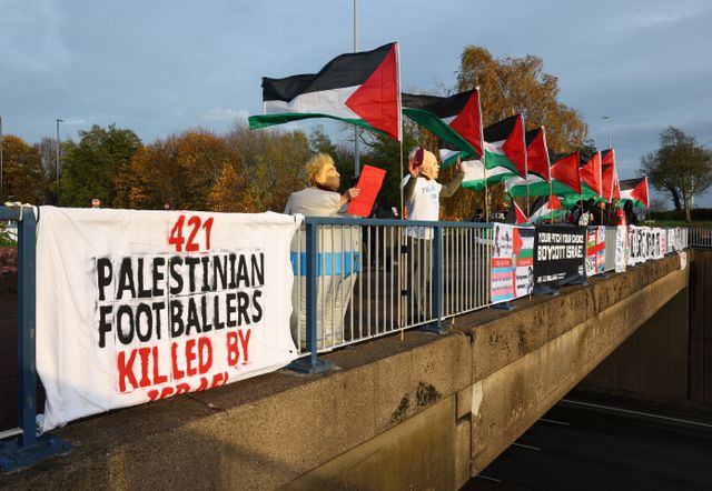 Pro-Palestinian protesters awaited Maccabi fans in Birmingham with banners.