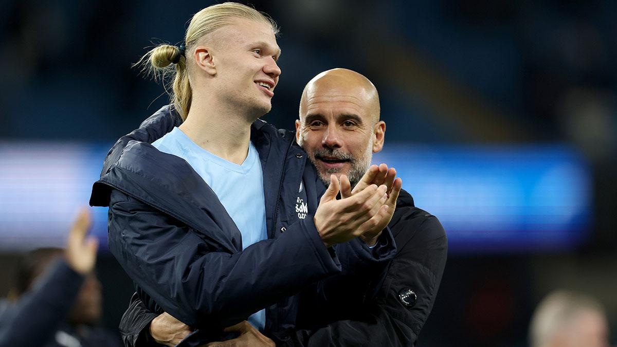 Manchester City manager, Pep Guardiola, with Erling Haaland celebrating the victory in the Premier League match against AFC Bournemouth