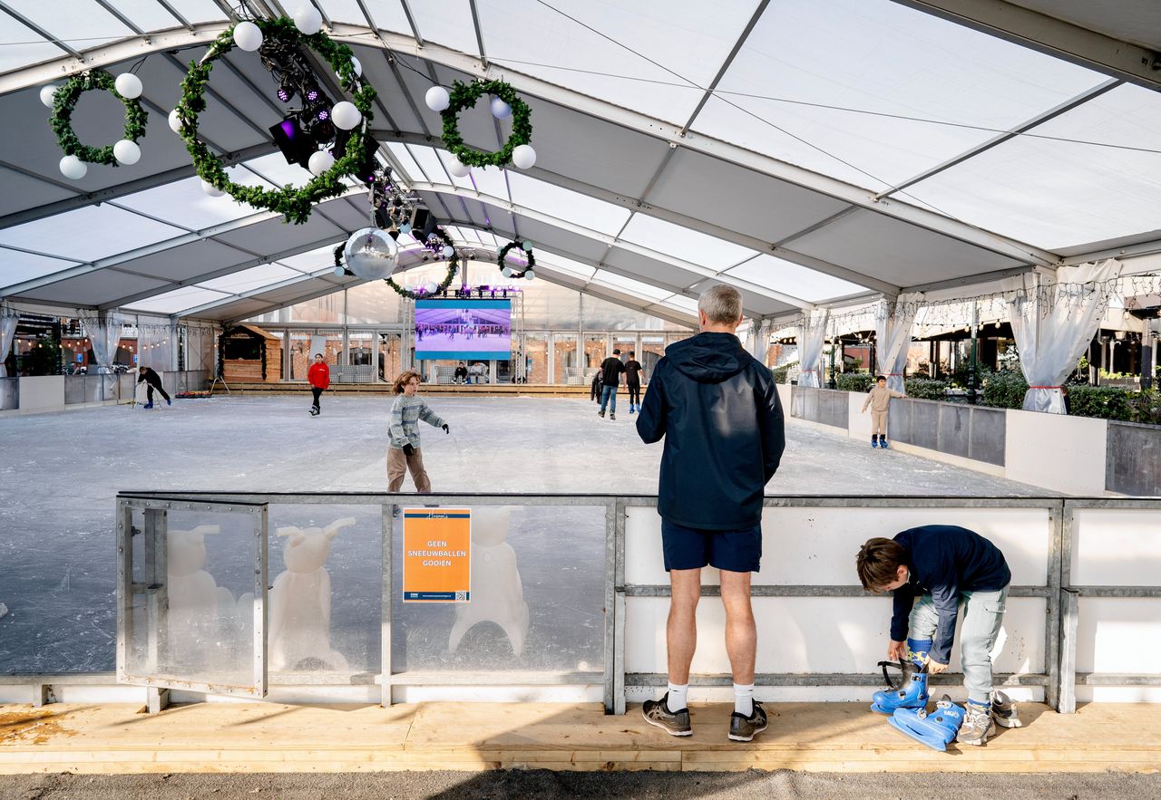 Visitors to the artificial ice rink. 